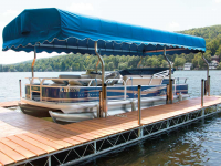 Custom canopy uprights that attaches to the dock system to create a covered boat slip with a standard canopy