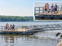 Commercial ADA fishing dock with slots in railings for fishing rods