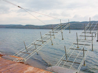 An articulating dock on Lake George that is raised for winter storage