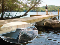 L-shaped pile dock that cantilevers on an existing boulder, Saranac Lake, NY