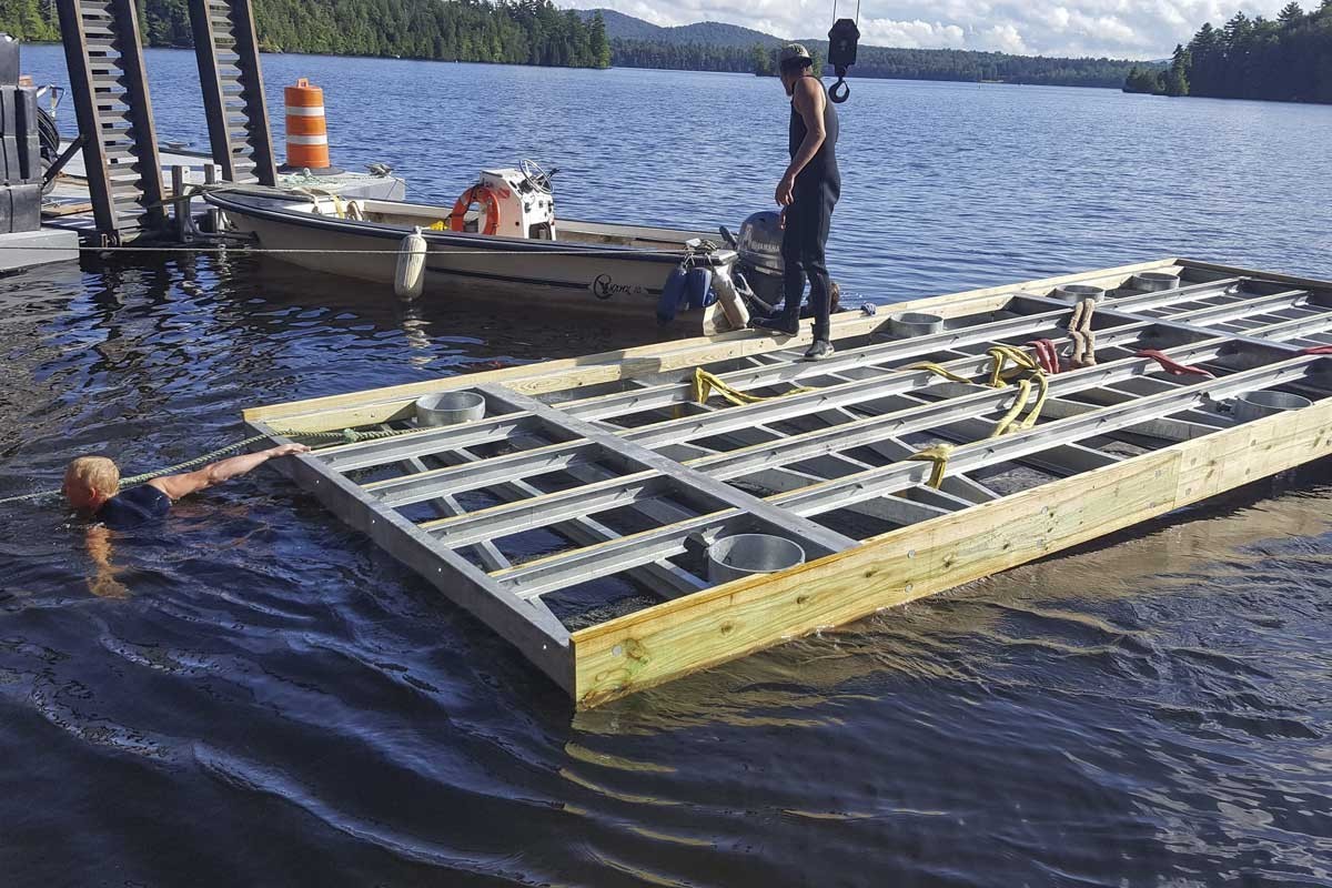 New pile dock being floated into place