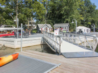 Gangway designed for golf cart access to bring guests to tour boat at a summer resort