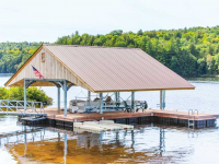 Boathouse with our steel truss floating docks as the foundation