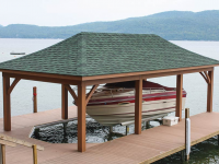 Boathouse with a hip roof built on a permanent pile dock