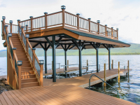 Pile dock with steel frame sundeck style boathouse & composite rails