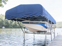 4,500 lb. vertical boat lift with Sunbrella canopy in pacific blue