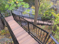 Freespan stairs with black powder coating and Ipe treads - these stairs traverse a vertical drop of 60 feet