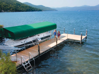 Our heavy duty steel truss leg dock with cedar decking, aluminum vertical boatlift with Sunbrella canopy 