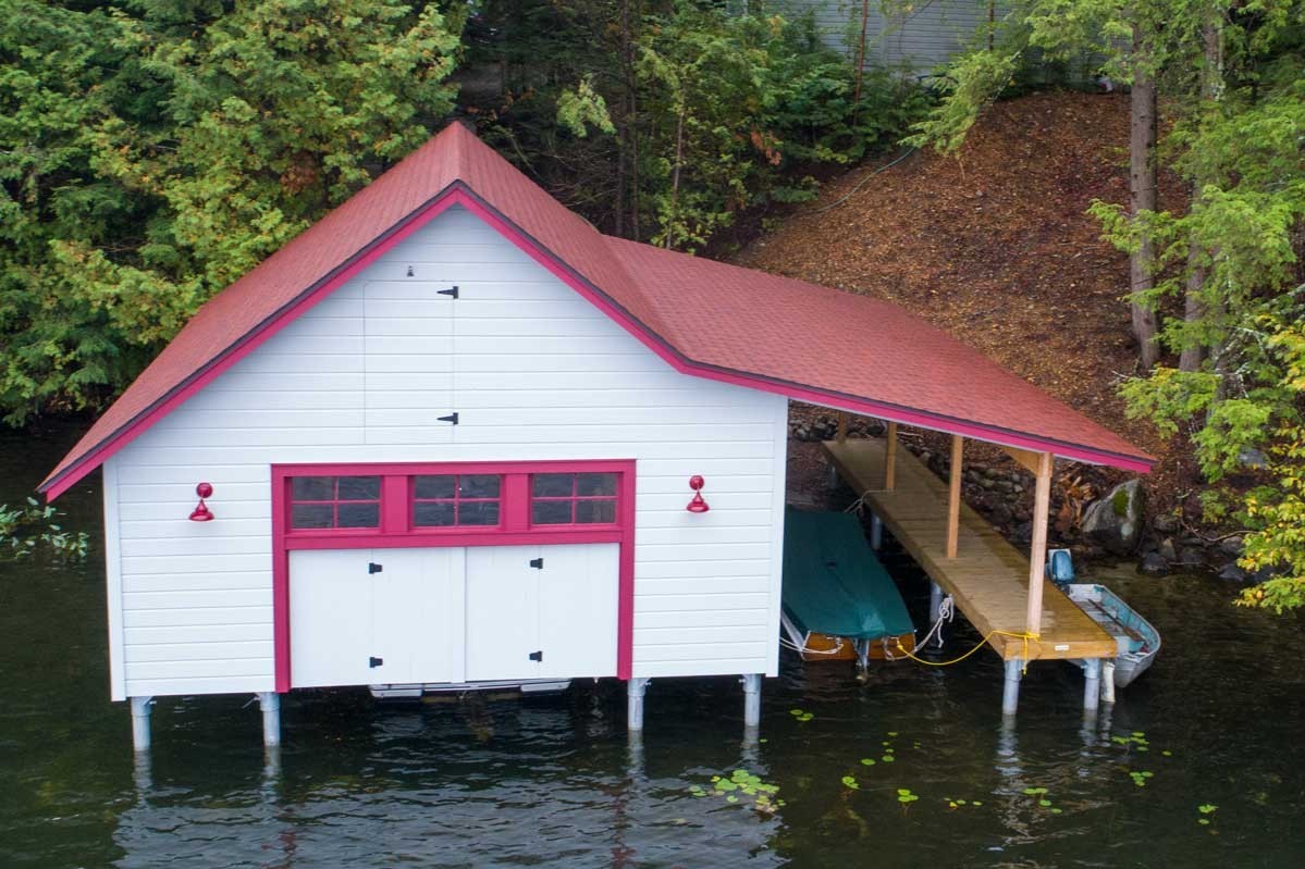Complete boathouse replacement with new pile dock foundation and designed to replicate the original 100 year-old design.