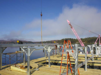 Floating foundation and boathouse support structure being erected on site