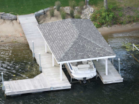 Floating foundation and boathouse with open style roof