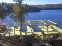 Floating foundation and boathouse support structure in place