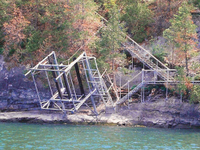 Customized boat lift that raises for winter storage at a site with no shoreline