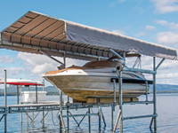 The Dock Doctors 9,000 lb. Ultimate Boat Lift with custom Sunbrella canopy