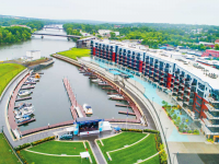 The Dock Doctors custom designed and manufactured the dock system to contour to the curved seawall and man-made basin. Mohawk Harbor, Schenectady, NY