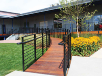 Commercial ramp with galvanized steel railings with a black powder coated finish