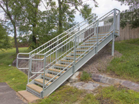 Commercial galvanized steel stairs and walkway with spindle rails and pressure treated treads