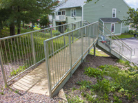 Commercial galvanized steel stairs and walkway with spindle rails and pressure treated treads