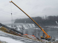 Installation of 112' long industrial free span stairs at a hydro power plant