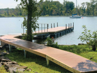 Galvanized steel truss floating dock with our pile dock as a shore-hitch for a site with seasonal high-water