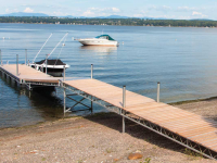 Heavy duty steel truss dock with our Mega Dock used as a transition, designed for a site with high spring water levels