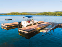 U-shaped custom floating dock with Ipe decking & integrated launch ramp