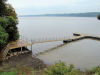 Steel truss floating dock hitched to shore with our permanent pile system, Hudson River, NY
