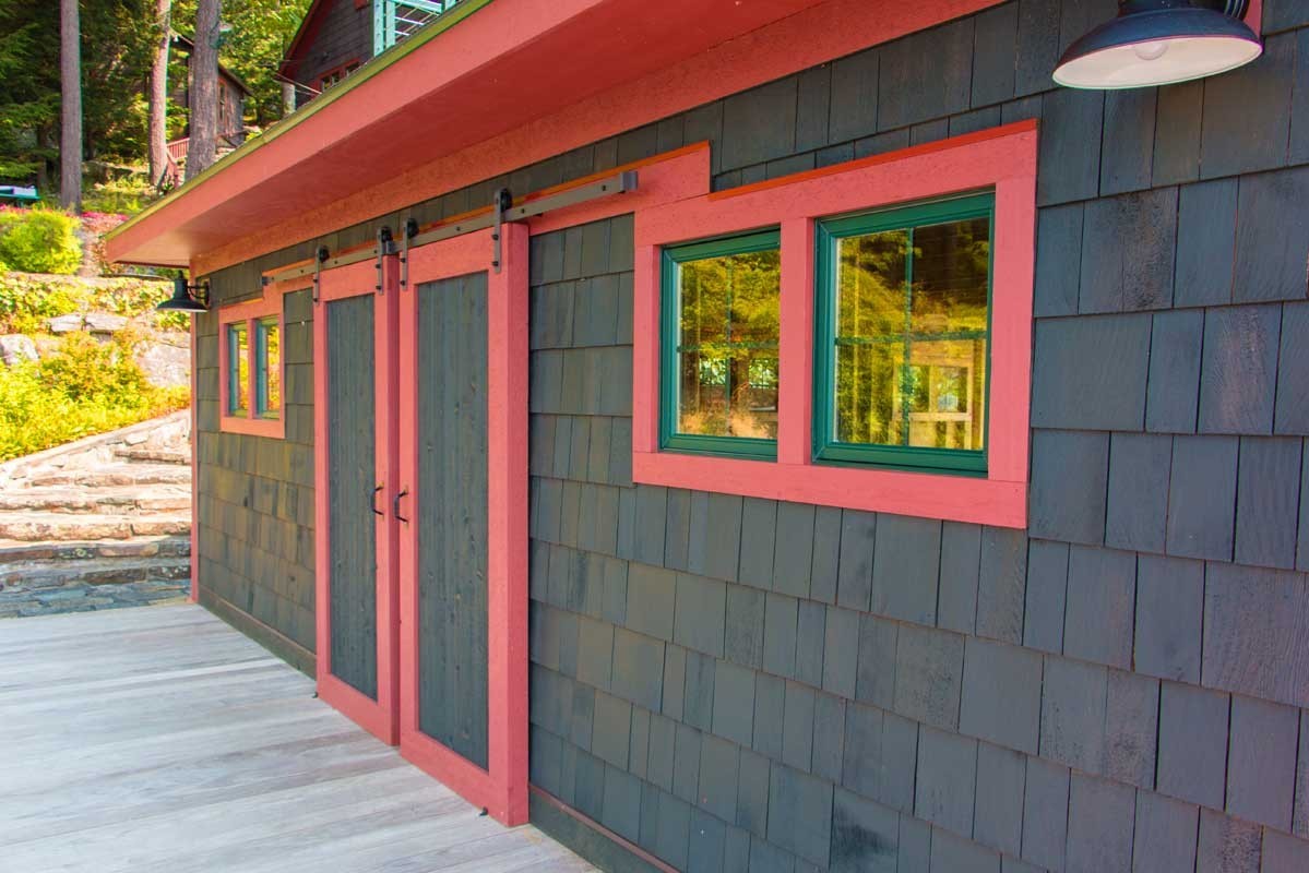 Sliding barn-style doors to access the interior of the boathouse