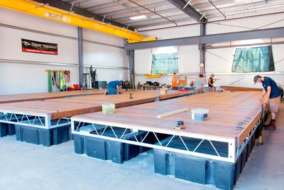 Decking being applied to the floating docks in our workshop.