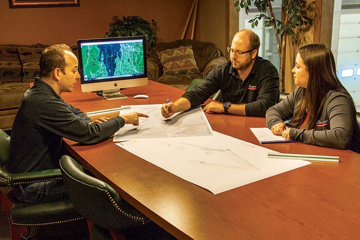 Our sales staff and head drafter planning a new project