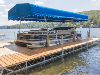 U-shaped articulating dock with aluminum canopy frame and Sunbrella boat canopy