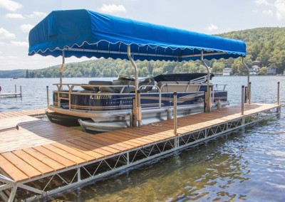 U-shaped articulating dock with custom aluminum canopy frame and sunbrella canopy