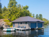 Pile dock boathouse foundation with completed boathouse (boathouse by others)