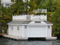 Sundeck style enclosed boathouse with our pile dock as a foundation