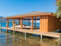 Our permanent pile dock serves as the foundation for this boathouse (boathouse constructed by others)
