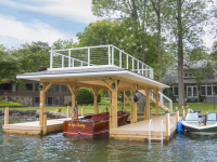 Crib dock with sundeck style boathouse