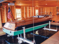 Boathouse lifts with drives mounted above the ceiling for aesthetics.