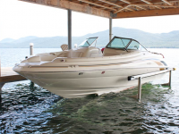 Hydraulic boat lift installed in a boat house on Lake George NY