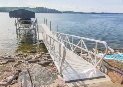 Mega dock with NyloDeck® decking, aluminum gangway and our ultimate boat lift with Sunbrella® canopy