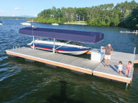 U-shaped floating dock with vertical boat lift & canopy.