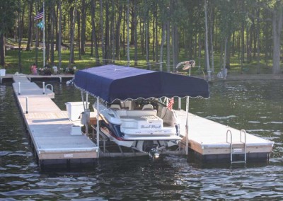 U-shaped floating dock with vertical boat lift & canopy.