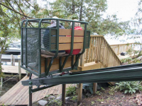 Hillside trolley serves as an alternative to stairs on a steep site on Lake George NY