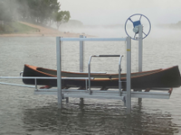 Our Launch Port Lift with an Adirondack Guide Boat on a lake in Wisconsin