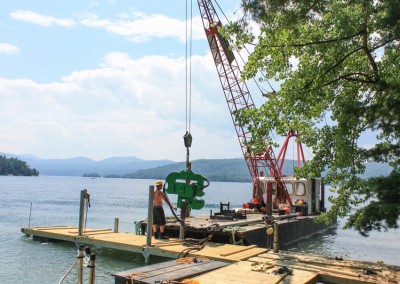 Piles being driven into the lake with pile driver