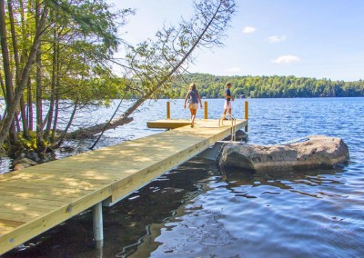 L-shaped pile dock with custom mounts to attach to boulders, Saranac Lake, NY