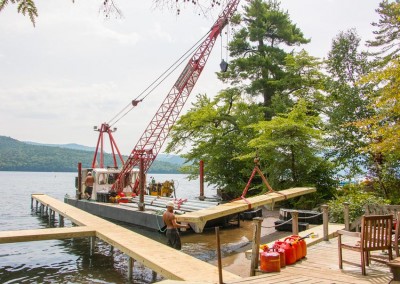 Our work boat Doc, moving a pile dock section into position