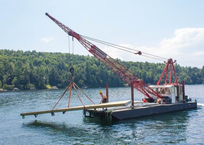 Our workboat transporting a pile dock section