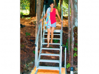 Aluminum stairs to access a dock on a sloped shoreline