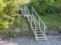 Aluminum stairs with our 3' x 4' stair platform as a transition platform