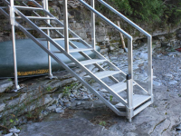 Our aluminum stairs have adjustable legs and footpads for uneven terrain